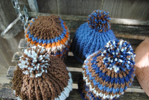 I am so glad that it's Friday again. I have been working hard on some little baby boy hats. I just love the way they look all lined up in a little square. The orange, brown, blue, and gray one will have a pom pom on it too. I just didn't have enough time before heading off to work yesterday morning.